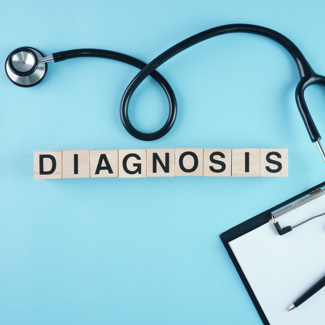 photo of the word diagnosis spelled with wooden cubes and Stethoscope